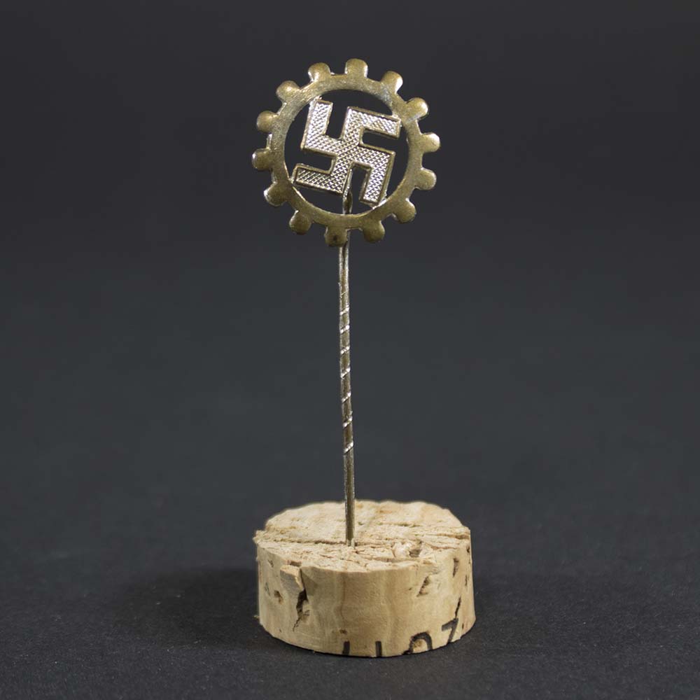 ront view of original DAF membership pin from Nazi Germany, showing German Labour Front insignia and detail, in good condition.