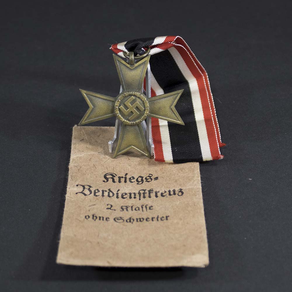 Front view of original War Merit Cross with Swords, maker marked '41' in the ring, showing detailed design and good condition, WWII-era German military decoration.