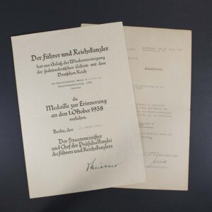 Official award certificate for the 1 October 1938 Sudetenland Commemorative Medal, featuring printed German text, official stamps, and a signature, recognizing participation in the occupation of the Sudetenland