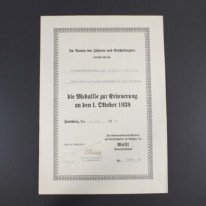 Official award certificate for the 1 October 1938 Sudetenland Commemorative Medal, featuring printed German text, official stamps, and a signature, recognizing participation in the occupation of the Sudetenland.