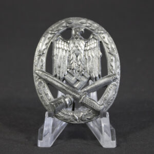 Front view of the General Assault Badge, showing the detailed eagle design clutching a swastika above crossed bayonet and grenade, with much of the original silver finish intact