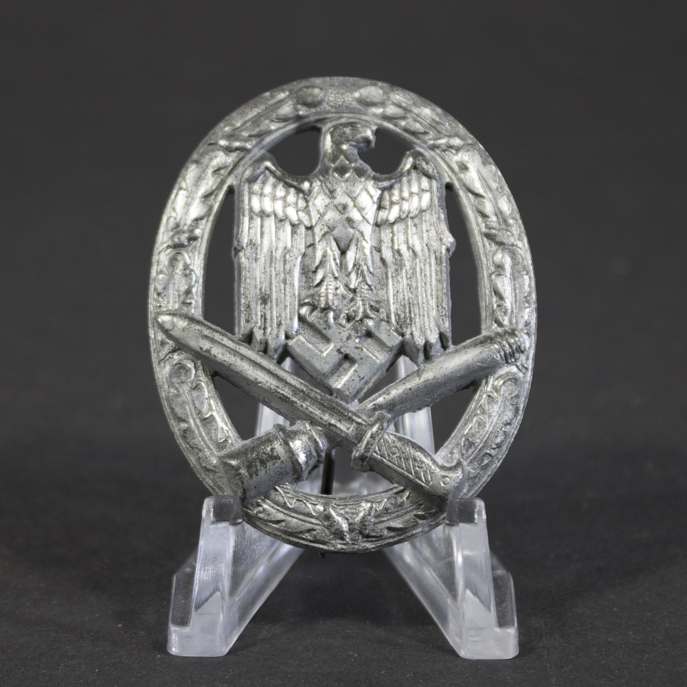Front view of the General Assault Badge, showing the detailed eagle design clutching a swastika above crossed bayonet and grenade, with much of the original silver finish intact