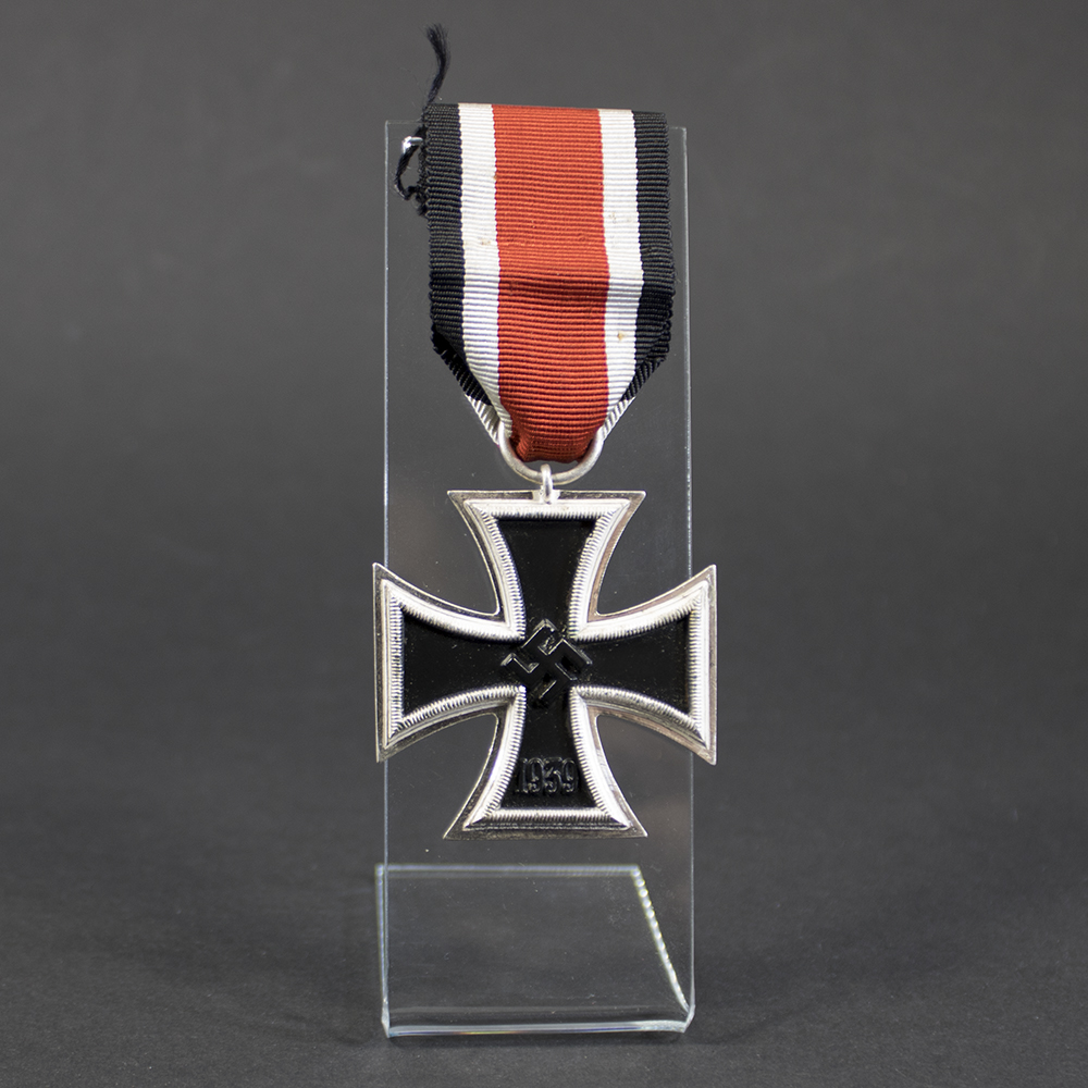 Iron Cross 2nd Class displayed together with its original ribbon, highlighting the complete set in excellent condition.