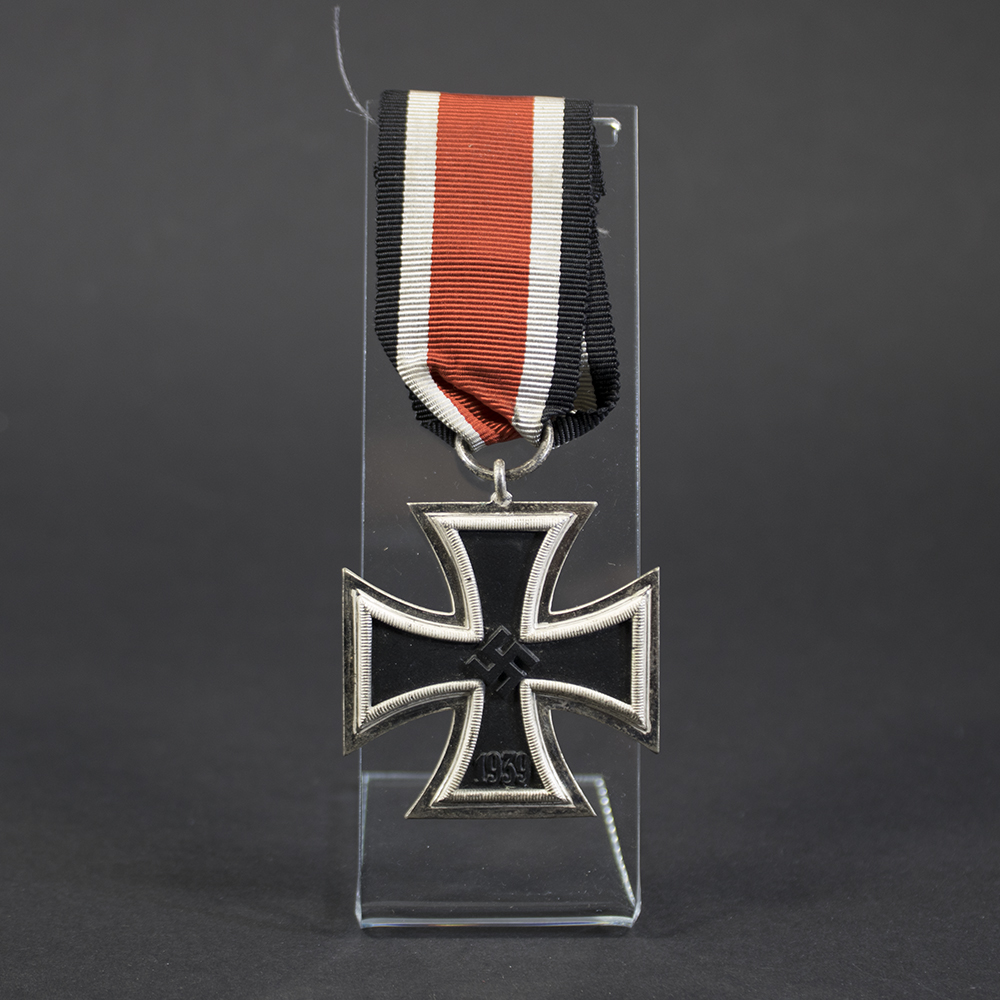 Iron Cross 2nd Class displayed together with its original ribbon, highlighting the complete set in excellent condition.