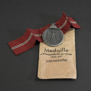 Full front view of the Eastern Front Medal (Ostmedaille) in very good condition, showing the eagle clutching a swastika above a crossed sword and branch.