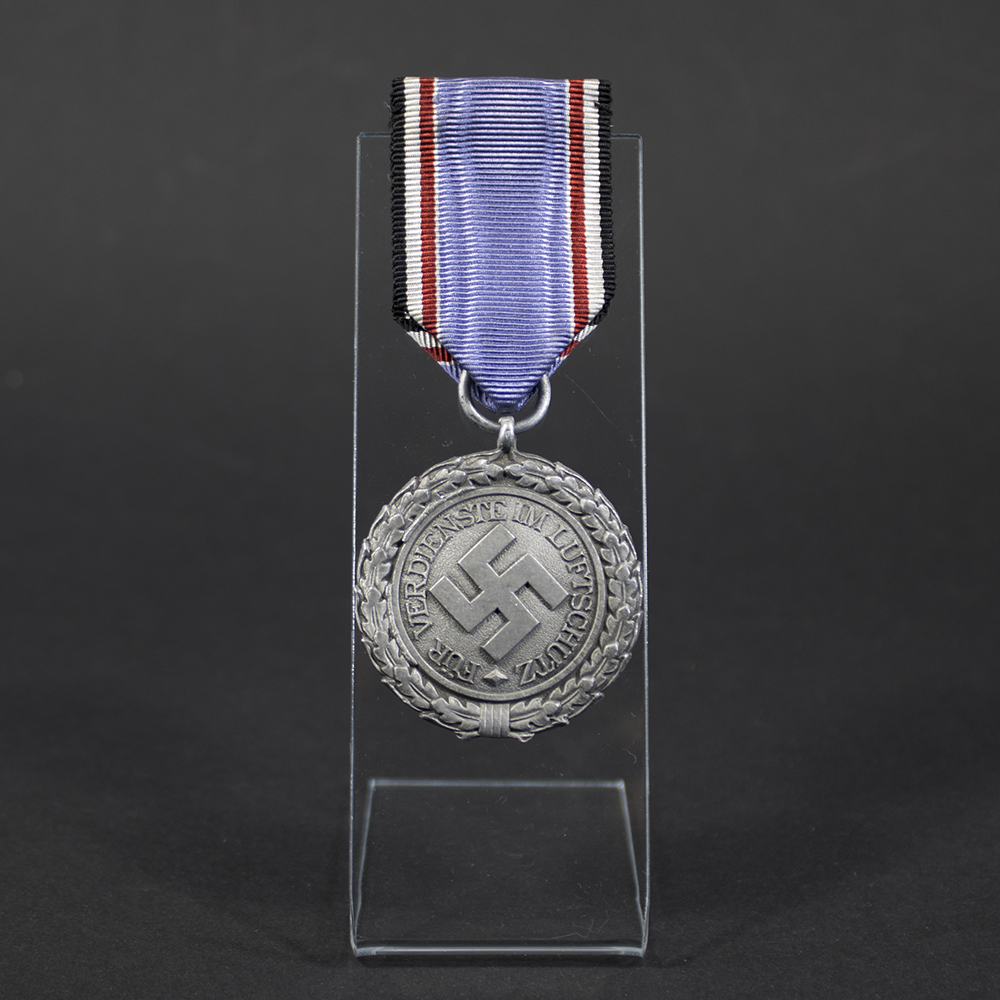 Full front view of the Luftschutz Air Defence Medal 2nd Class, lightweight version, showing the eagle emblem with swastika and wreath design.