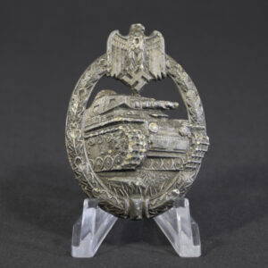 Full front view of original WWII German Panzer Assault Badge in bronze by Zimmermann, showing tank motif and wreath design with worn finish.