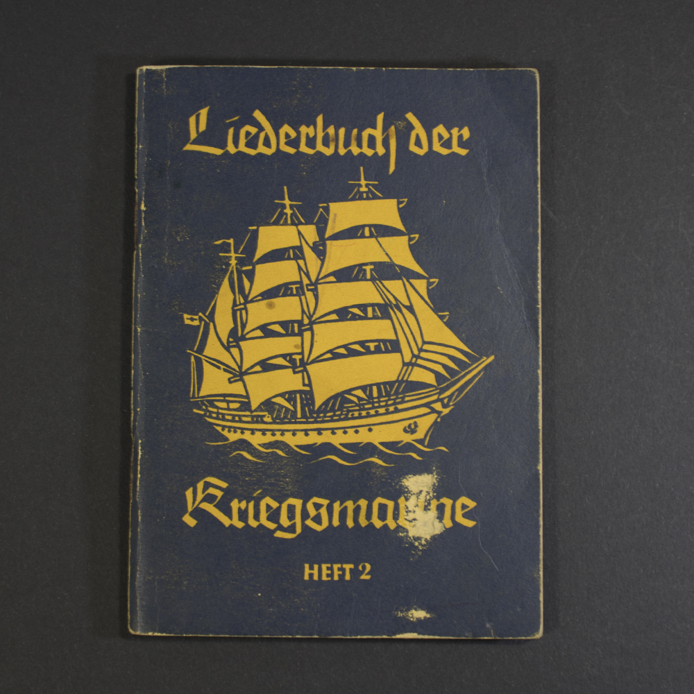 Front cover of WWII German songbook ‘Liederbuch der Kriegsmarine – Heft 2,’ showing title text and naval emblem.