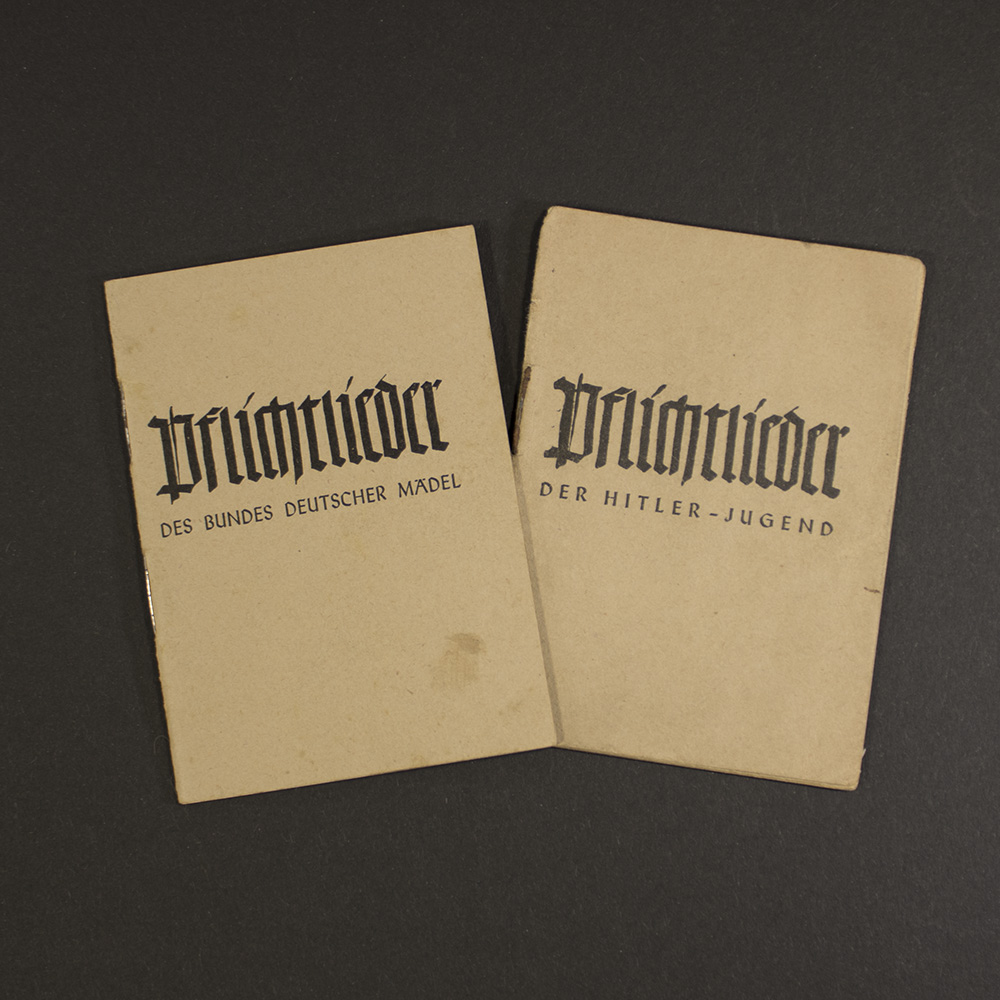 Front cover of the “Pflichtlieder” songbook set, featuring original German text and historical design elements from the Hitler Youth era