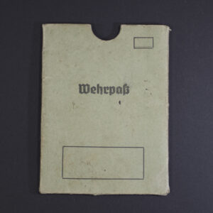 Front view of an original WWII German Wehrpass cover in good condition, showing authentic design and texture.