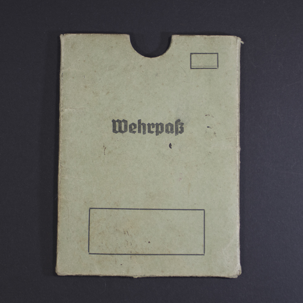 Front view of an original WWII German Wehrpass cover in good condition, showing authentic design and texture.