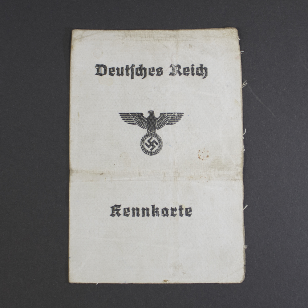 Front view of an original WWII German Kennkarte (ID card) issued to a woman, showing personal details and official markings.