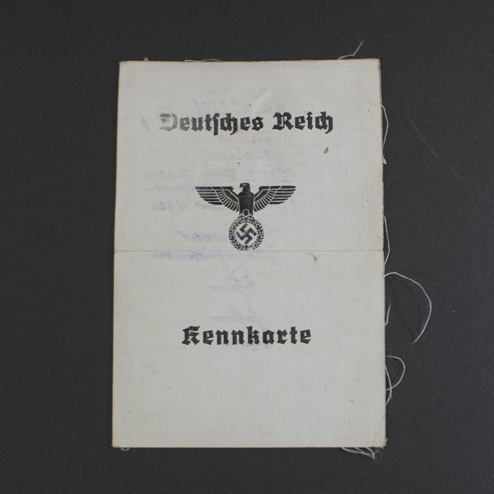 Front view of an original WWII German Kennkarte (ID card) issued to a woman, showing personal details and official markings.