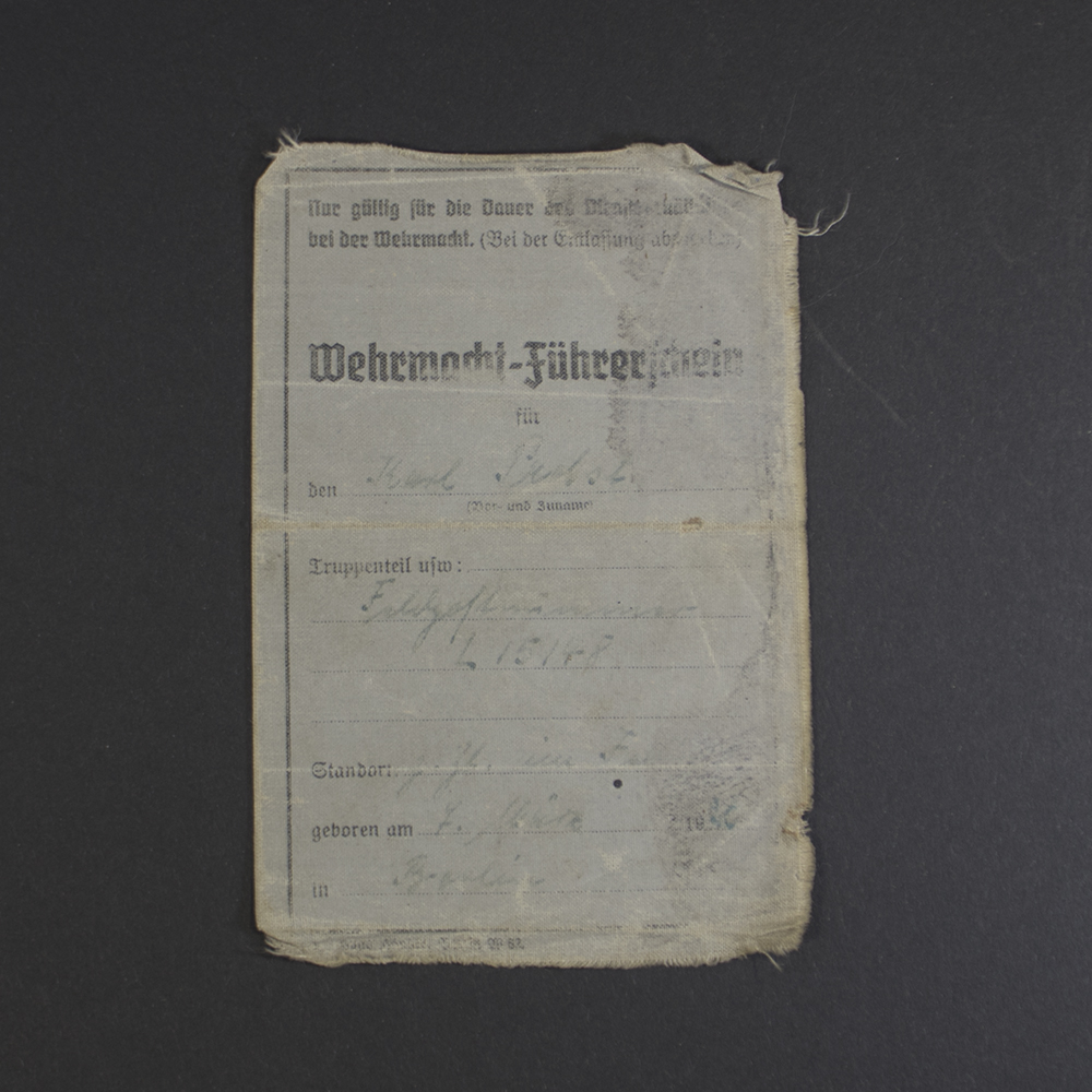 Front view of an original WWII Wehrmacht Führerschein (German military driver’s license) in used condition, showing authentic cover details.