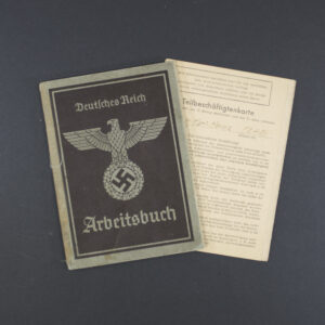 Front cover of a German World War II labor book (Arbeitsbuch), featuring the title ‘Arbeitsbuch’ in Gothic script, an eagle emblem with a swastika, and worn brown paper with visible creases.