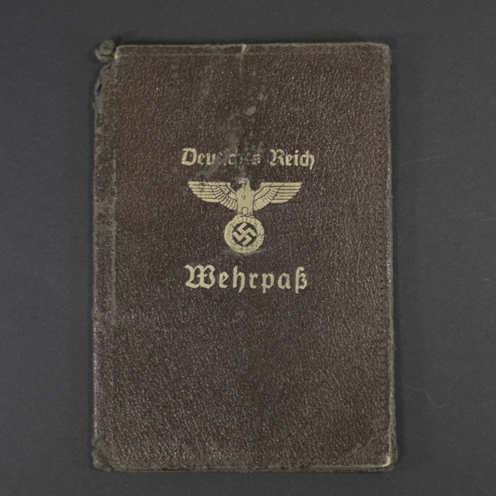 Front view of an original WWII German Wehrpass cover in good condition, showing authentic design and texture.