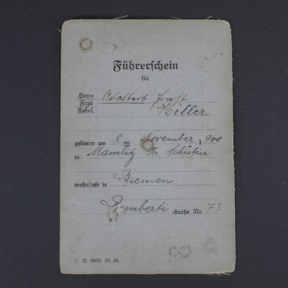 Front cover of a WWII German driver’s license showing the title in German, official emblem, and a textured paper surface with signs of age.