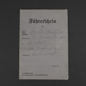 Front cover of a WWII German driver’s license showing the title in German, official emblem, and a textured paper surface with signs of age.