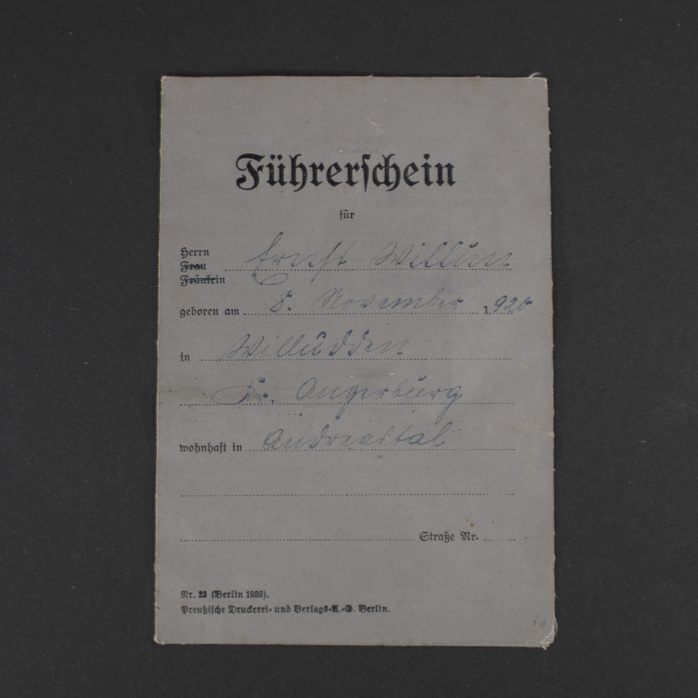 Front cover of a WWII German driver’s license showing the title in German, official emblem, and a textured paper surface with signs of age.