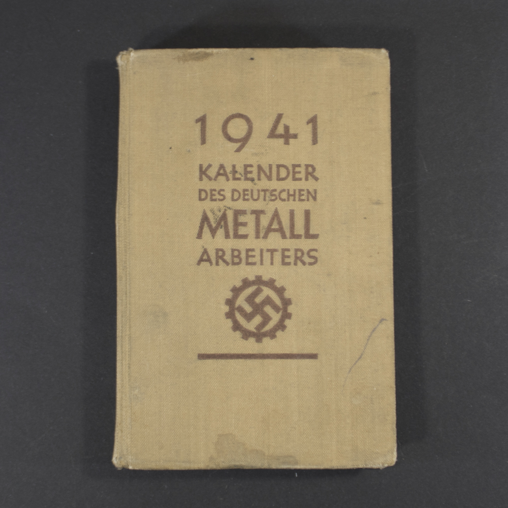 Front cover of the book ‘1941 Kalender des deutschen Metallarbeiters’ featuring the title in bold Gothic script and the RAD (Reichsarbeitsdienst) logo prominently displayed, printed on a textured background.