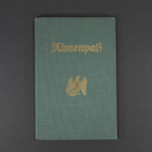Front cover of a German Ahnenpass, featuring Gothic script title ‘Ahnenpass’ and decorative border on aged green paper.