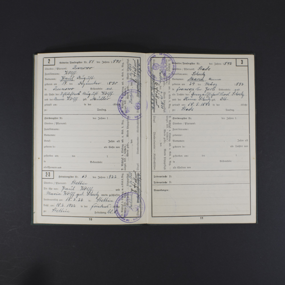 Inside pages of the Ahnenpass showing handwritten entries, official stamps, and printed sections for family lineage and ancestry details in German text