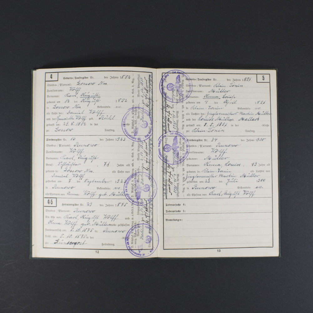 Inside pages of the Ahnenpass showing handwritten entries, official stamps, and printed sections for family lineage and ancestry details in German text