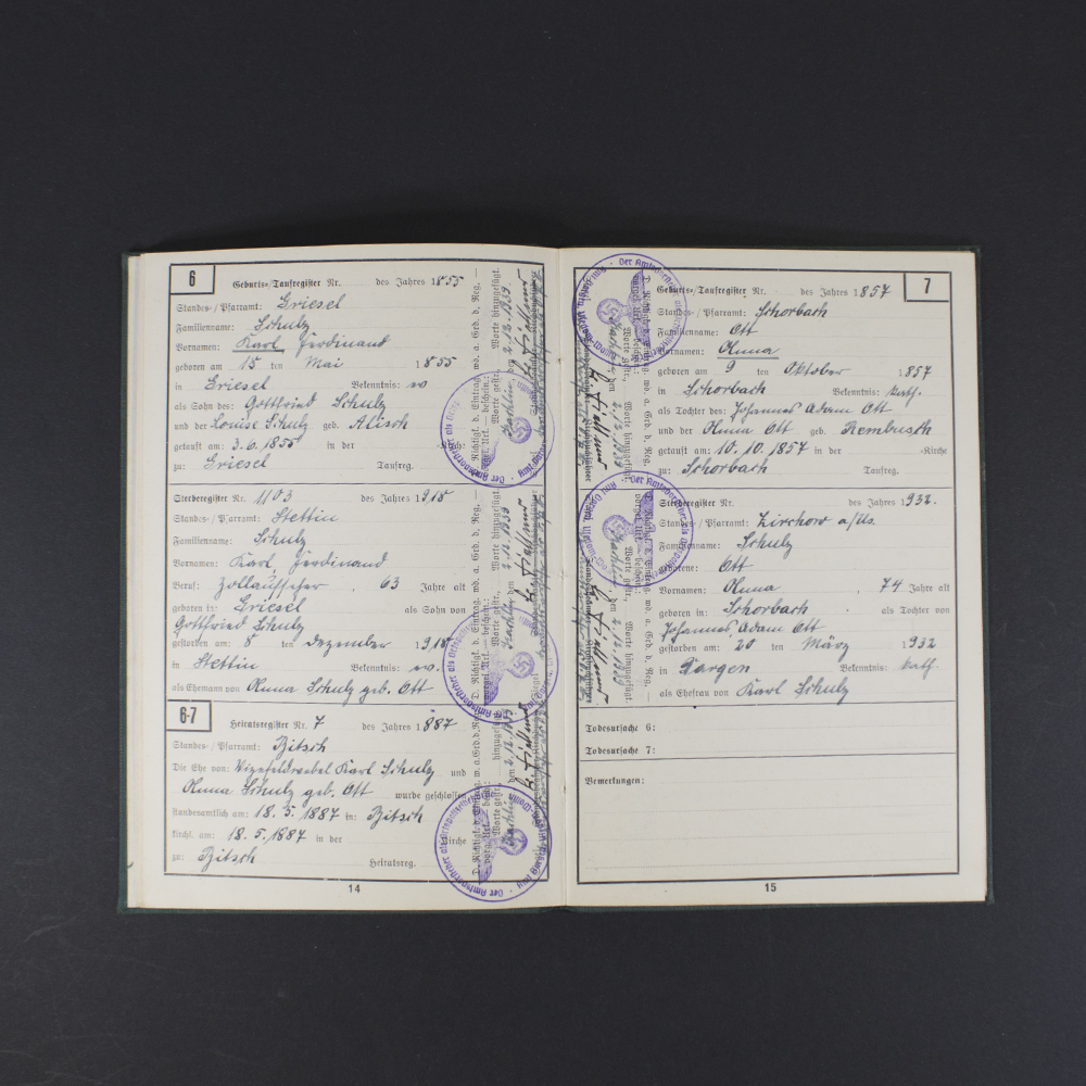 Inside pages of the Ahnenpass showing handwritten entries, official stamps, and printed sections for family lineage and ancestry details in German text