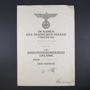 Front side of the award document for a World War II War Merit Cross, showing official printed text, stamp, and handwritten details.