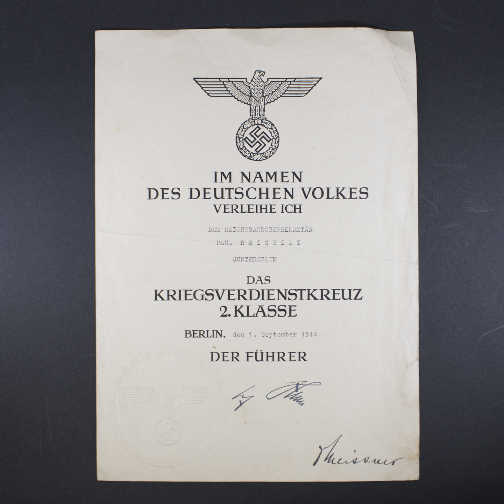 Front side of the award document for a World War II War Merit Cross, showing official printed text, stamp, and handwritten details.