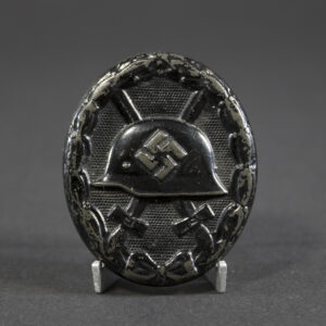 Full view of a WW2 Black Wound Badge, showing its oval shape and overall condition
