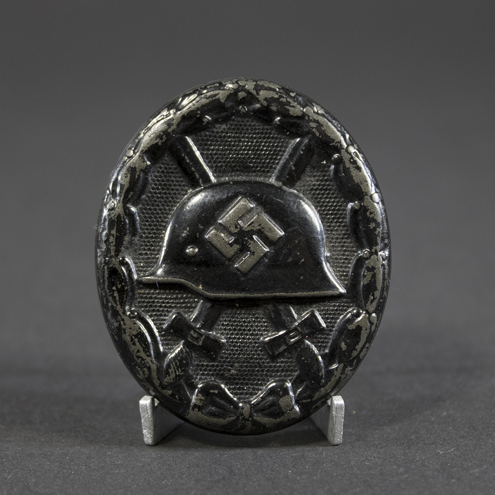 Full view of a WW2 Black Wound Badge, showing its oval shape and overall condition