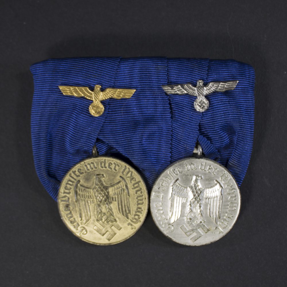 Medal bar featuring Wehrmacht 4-year and 12-year service medals, front view showing both medals and ribbon details.