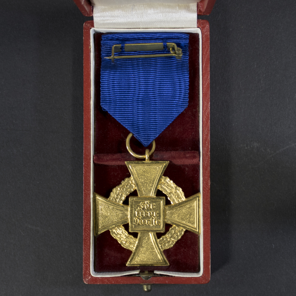 The reverse side is plain with a smooth finish, showing minor scratches and signs of wear.