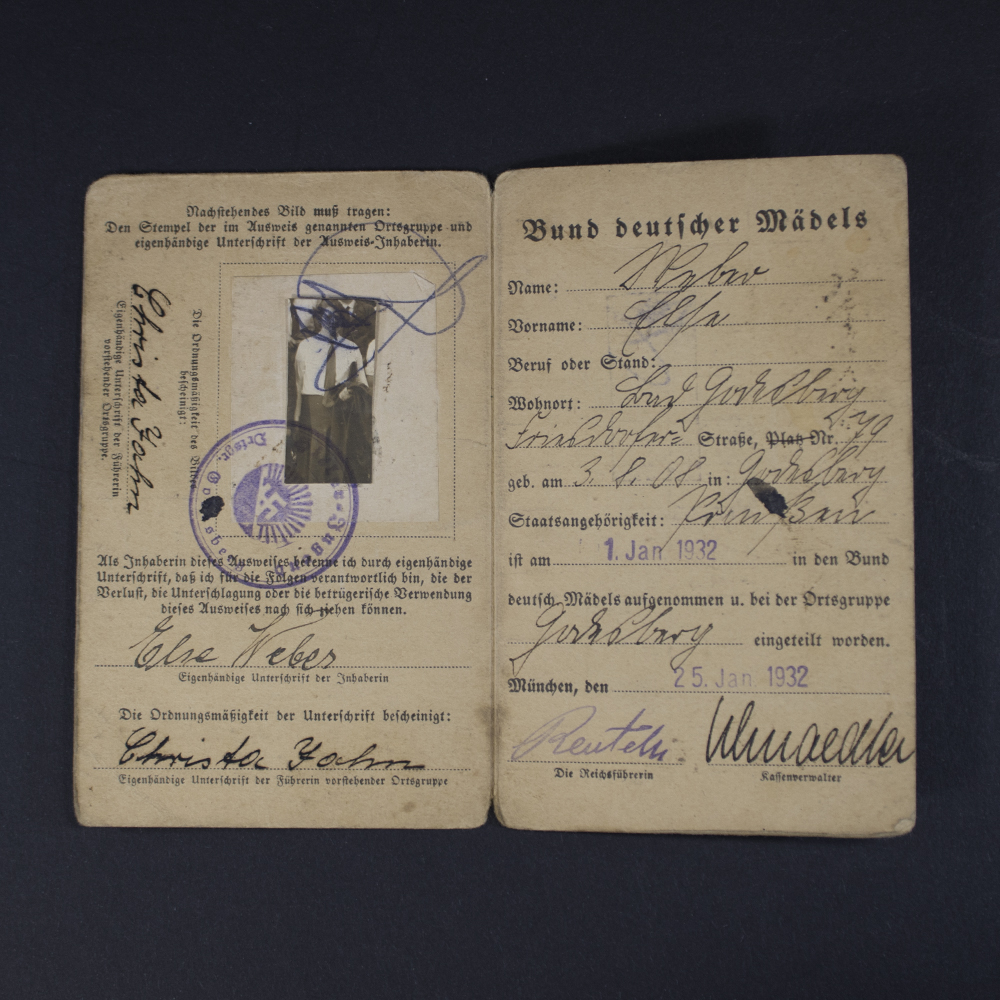 Interior view of the BDM membership pass, showing printed member details and decorative elements on both pages.