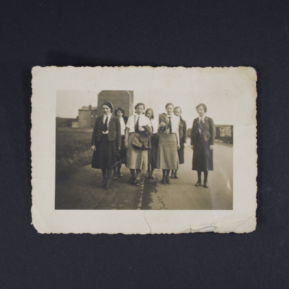 High-resolution image of the extra photo included with the membership pass, showing a portrait with clear facial details and a neutral background.