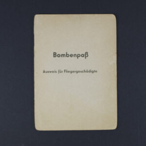 Front cover of the item, showing title in German script with emblem and aged texture