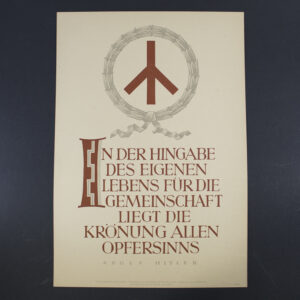 "Front of an NSDAP Wochenspruch poster featuring bold blackletter German text centered on a plain background. The quote is framed by a simple border, with the party emblem (swastika) in the lower corner. The design is minimalistic, emphasizing the ideological message."