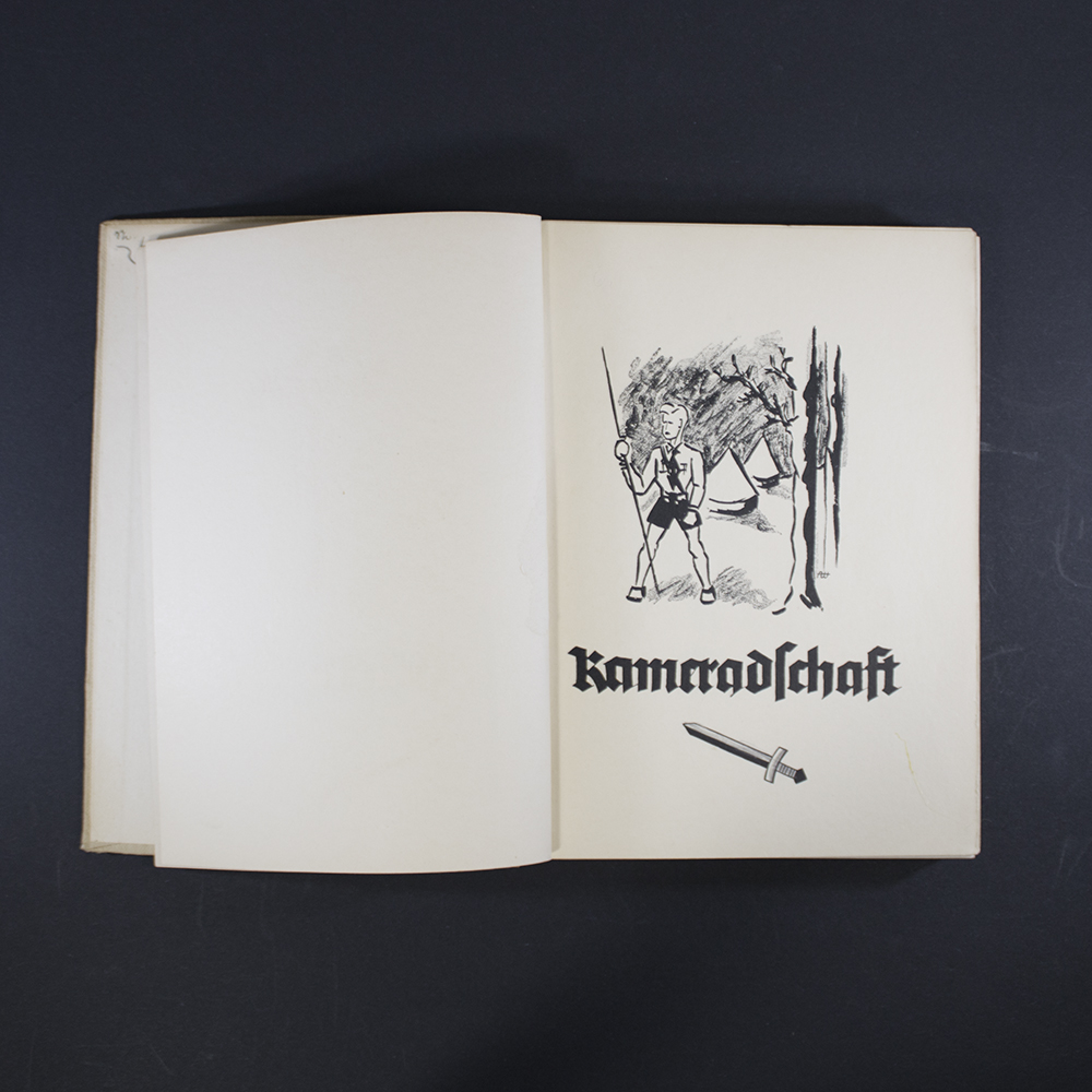 “Third inside illustration showing a Hitler Youth leader instructing a group of boys, emphasizing discipline and training.”