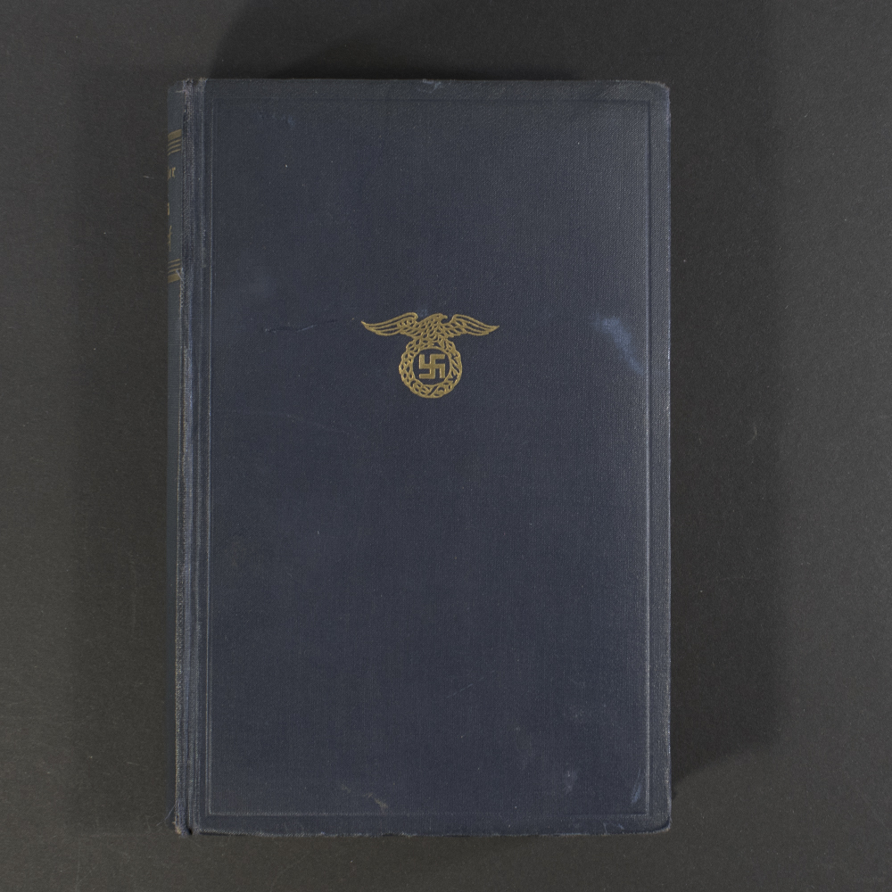 Front cover of a 1933 edition of Mein Kampf, featuring the title in bold Gothic script and a plain background typical of early Nazi-era publications.