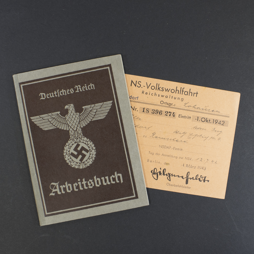 Front cover of a World War II German labor book, featuring the title ‘Arbeitsbuch’ and the Reich eagle emblem printed in black and extra document