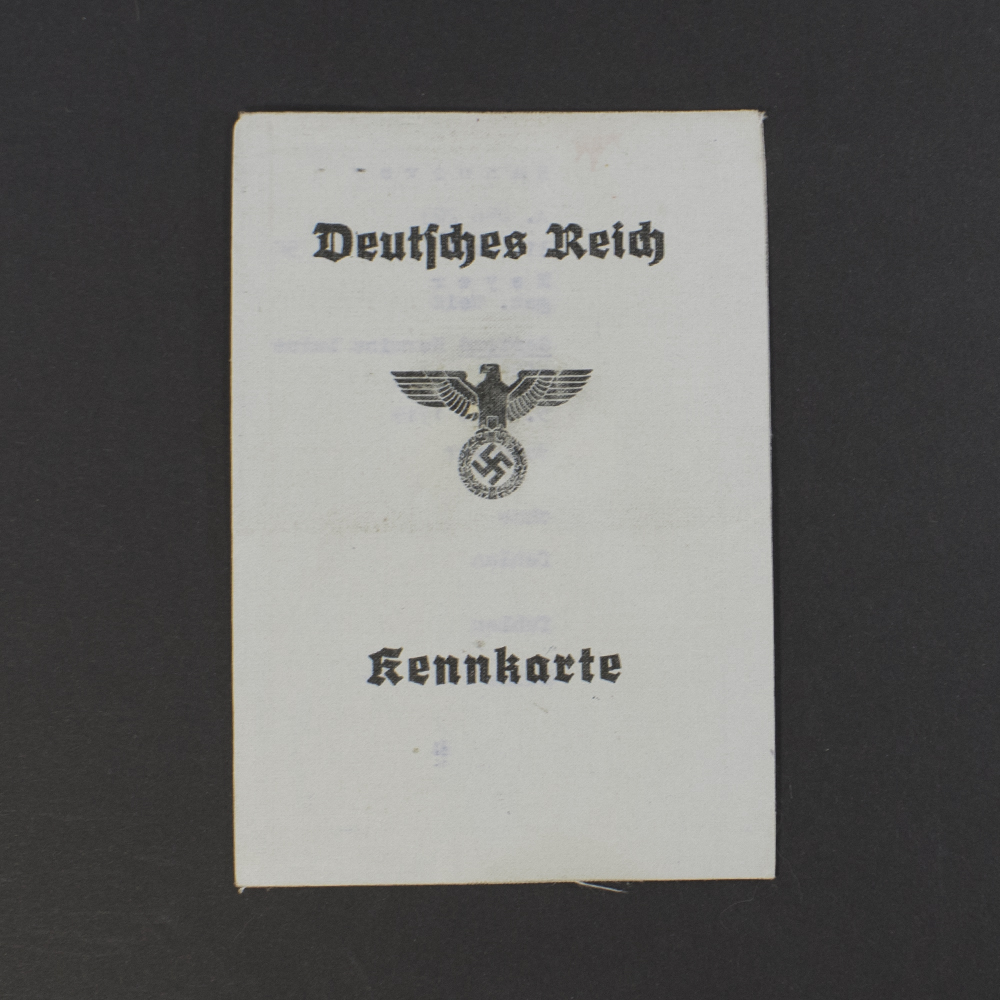 Front side of a World War II German Kennkarte identity card, showing official stamp, printed text, and personal details.