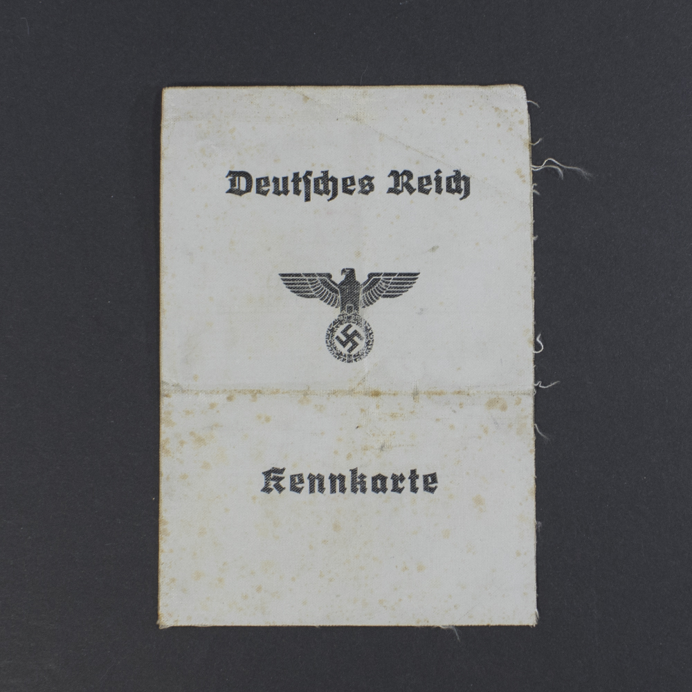 Front side of a World War II German Kennkarte identity card, showing official stamp, printed text, and personal details.