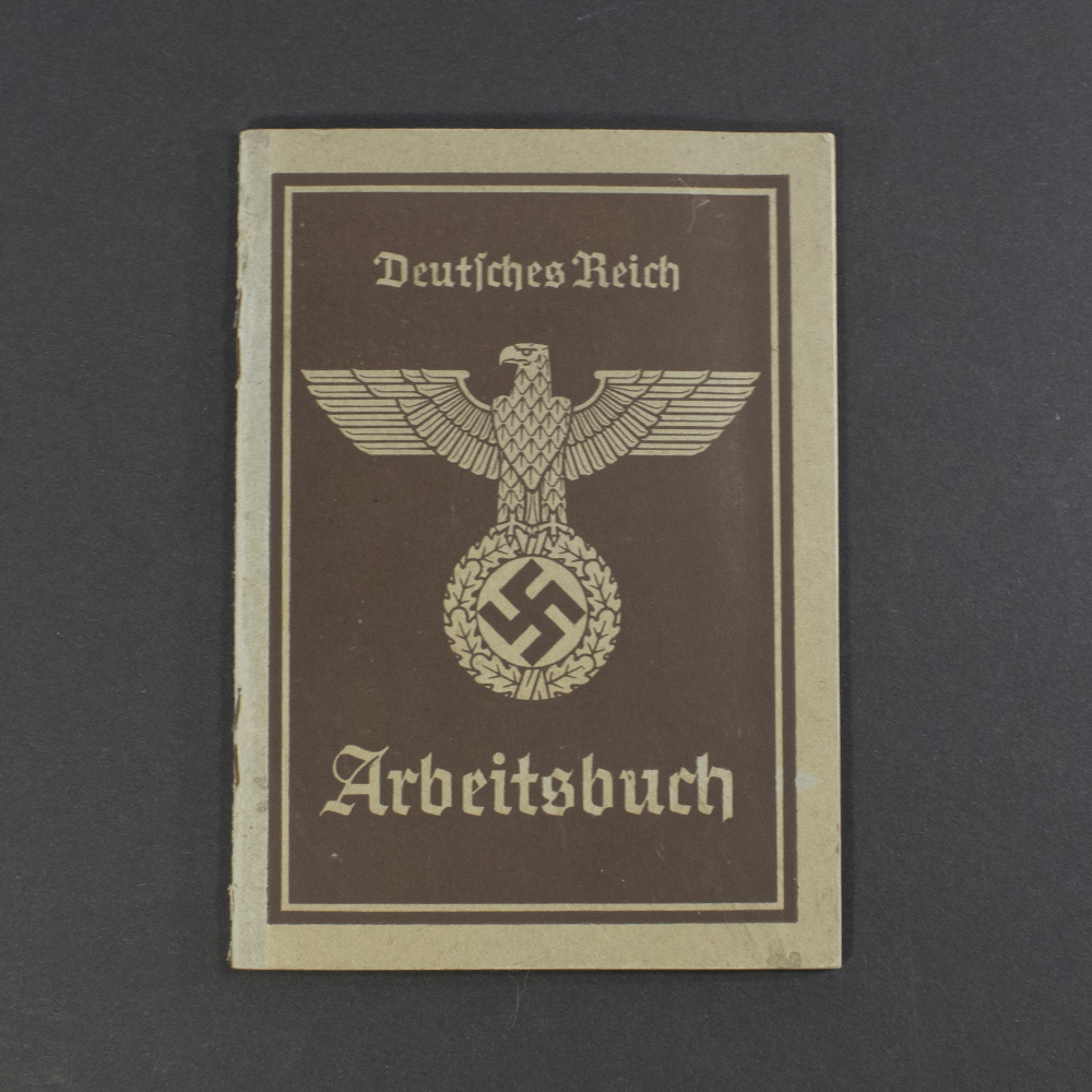 Front cover of a World War II German workbook, second form, showing title text and worn paper texture.