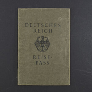 Front cover of a German WWII-era Reisepass, dark textured cover with the imperial eagle emblem and German text.