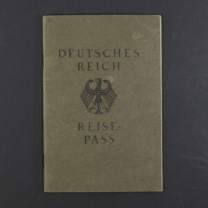 Front cover of a German WWII-era Reisepass, dark textured cover with the imperial eagle emblem and German text.