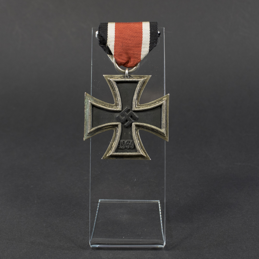 World War II German Iron Cross 2nd Class medal displayed flat, showing its blackened iron core with silver frame and suspension ring.