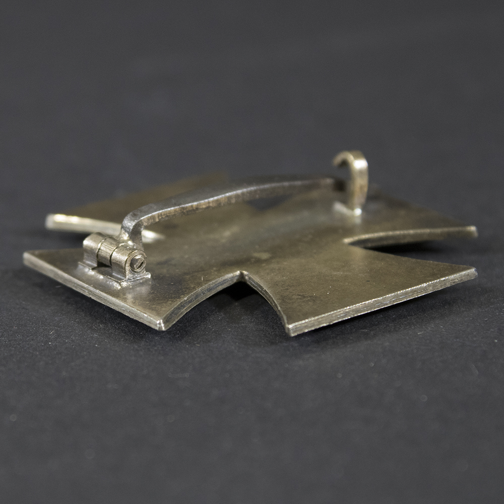 Detailed view of the hinge mechanism on the back of the Iron Cross 1st Class, showing its construction and attachment point