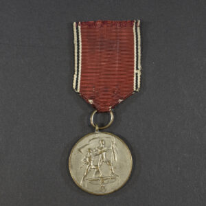 World War II German Austria Occupation Medal displayed on a flat surface, showing the front design and attached ribbon.