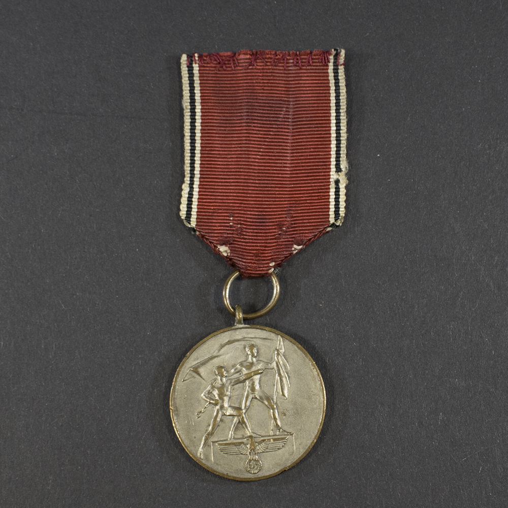 World War II German Austria Occupation Medal displayed on a flat surface, showing the front design and attached ribbon.